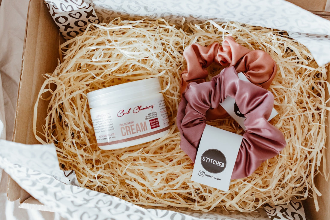 brown and white gift box on brown textile